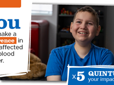 A picture of Ollie smiling while sitting in his bed room. The following is overlayed: "You can make a difference in a life affected by a blood cancer. Quintuple your impact today!"